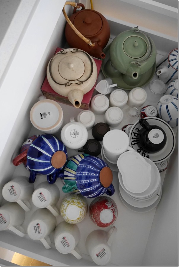 Cups, soup bowls, tea cups, saucers and teapots drawer